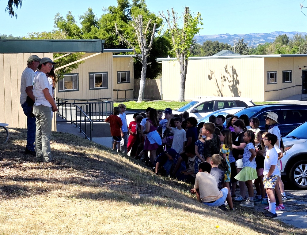Cory and Meg teaching the students about Arbor Day and tree planting.